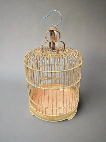 Set of traditional gold bamboo bird cages - large, medium, and small options available.