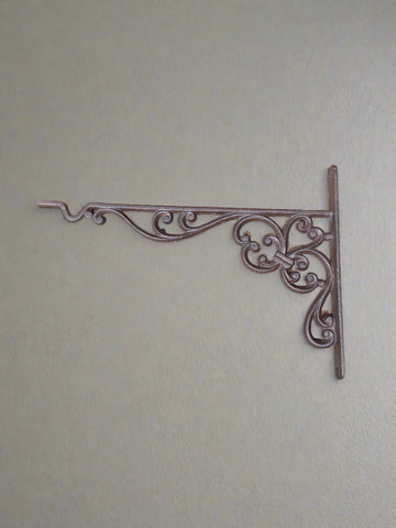 Ornate scroll cast iron shelf brackets with hooks for hanging items such as signs and flower baskets.