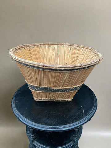 Traditional Mossi harvest basket, crafted from straw. The Mossi are an ethnic group native to Burkina Faso, West Africa. These deep baskets are used in ceremonies, primarily weddings, and are also used for collecting cereals during harvest.