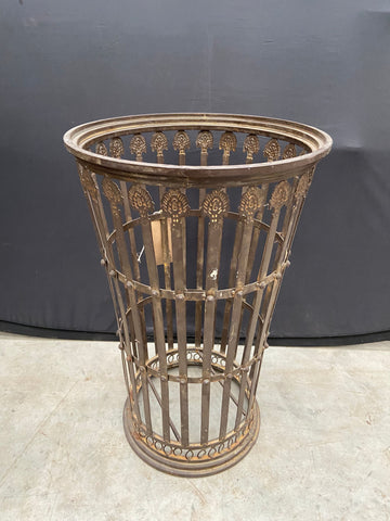 Ornate metal umbrella stands in a country house style.