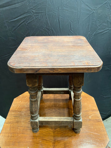 Small rectangular wooden side table with turned legs.