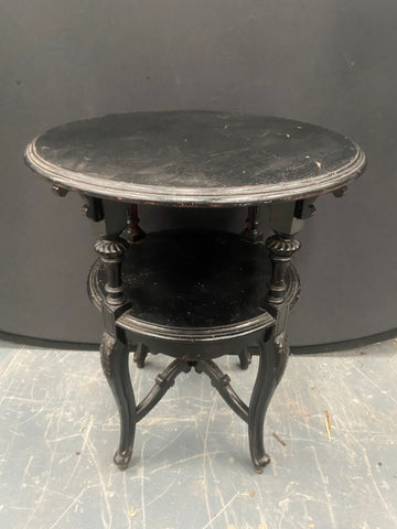 Victorian black ebonised round wood table with two tiers.&nbsp;