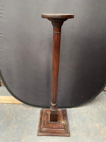 Antique wooden pedestal stand/ torchere with a ribbed stem. Likely Victorian.&nbsp;