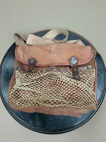Vintage Brady brown canvas hunting bag, circa 1940s/50s. With leather tying straps and a net pouch to the front.&nbsp;