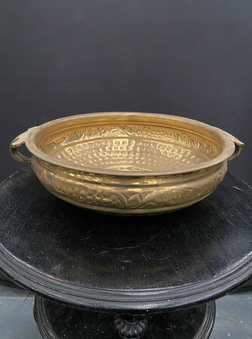 Large brass wash basin with a detailed pattern around the outer bowl.