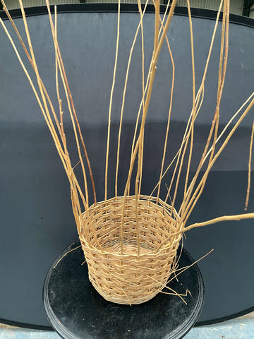 Unfinished round woven willow planter.