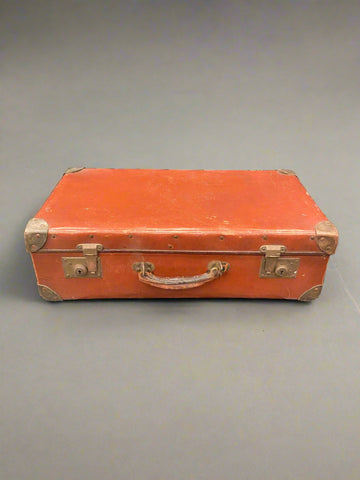 Red orange leather studded suitcase with copper hardware, circa 1930s.&nbsp;
