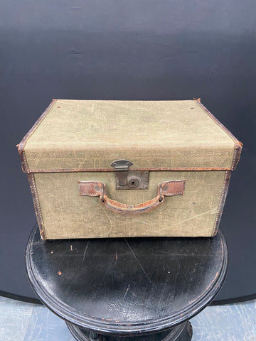 Square khaki canvas and leather travelling trunk. Could be used as hat transportation.&nbsp;
