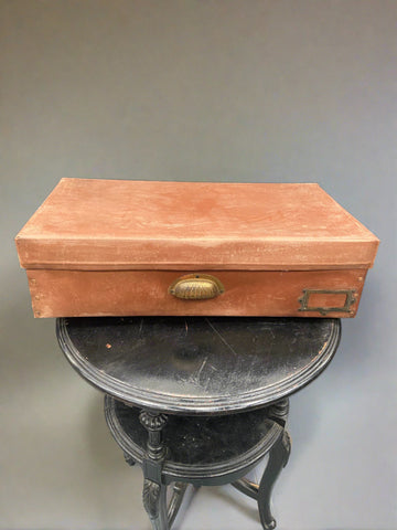 Brown rectangular document storage box with a brass pull handle.