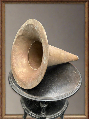 Rusty aged round gramophone horn cast in a cone shape.