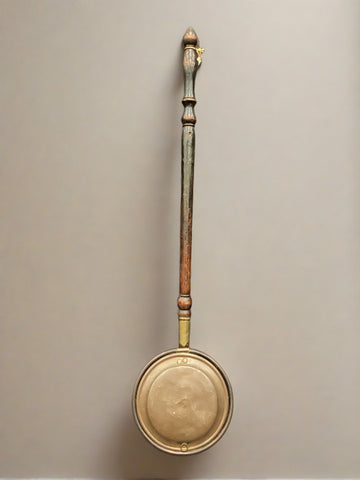 Simple copper and brass bed warming pan with a long mahogany-turned handle. Circa the late 1800s.