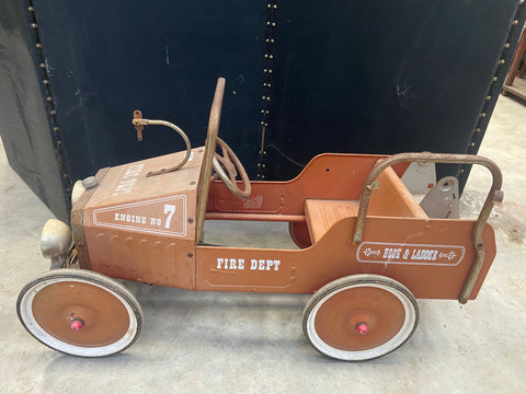 Kid's vintage pedal car fire engine with an orange metal frame.&nbsp;