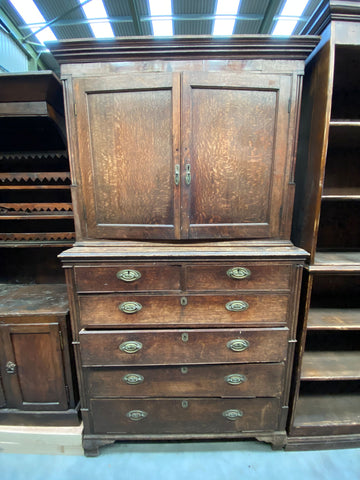 Double door antique wooden dresser with six drawers and oval shaped brass hardware.&nbsp;
