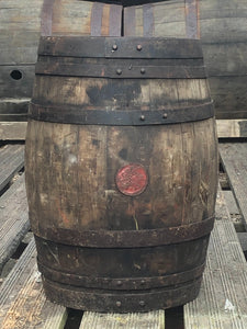 Copper banded barrel with well worn patina and inset circular motif panel of grapes.