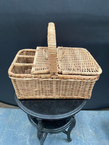 Traditional wicker picnic basket, designed to hold three bottles.