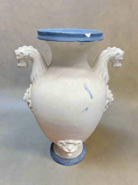 Grecian style blue and white decorative ceramic vase with seahorse-shaped handles.