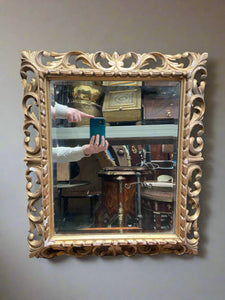 Large rectangular gold mirror, in an ornate regency style.