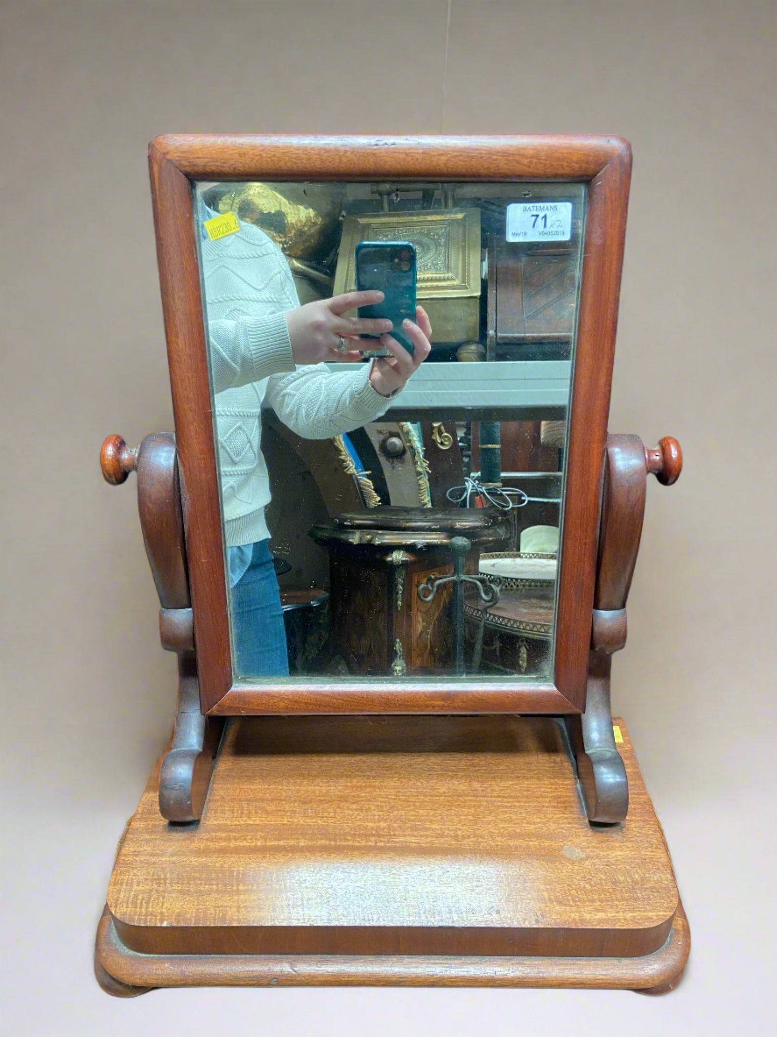 Simple rectangular dressing table mirror on a stand.