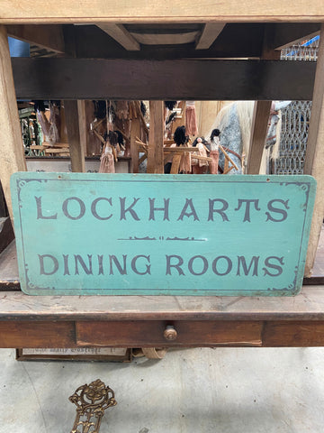 'Lockhart's Dining Room' signage, handpainted on teal wooden backboard Film TV Props