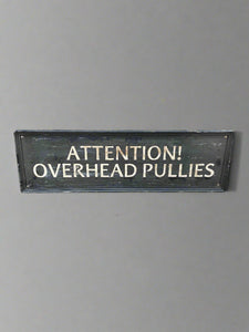 'Attention! Overhead Pullies' sign, painted onto framed wooden backboard Film TV Props