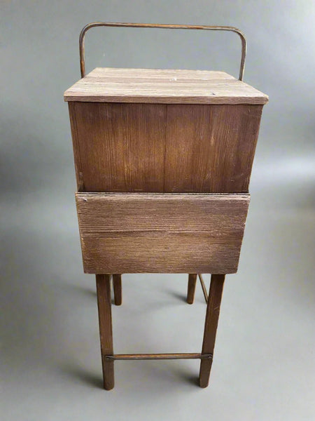 Unusual square wooden unit with a lift up flap which reveals hidden storage.