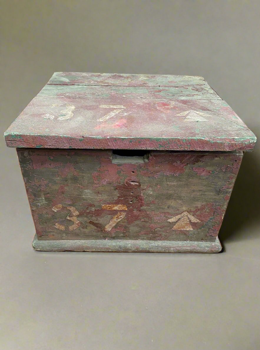 Small wooden rustic military box with flaking paint.