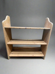 Three-tier simple pine kitchen shelf.