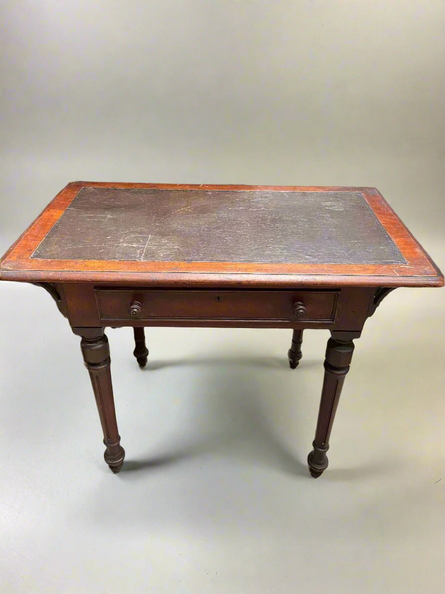 Victorian wooden writing desk with a single drawer and two tone top.