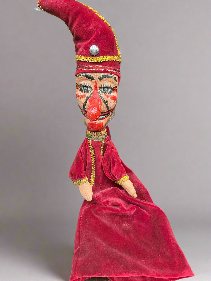 A Punch and Judy puppet and costume set.