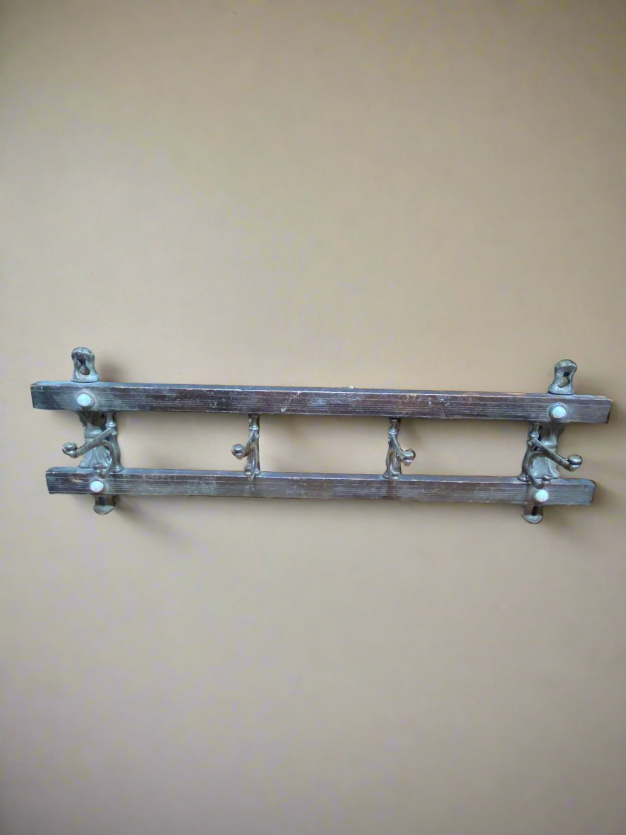 Wall-mounted coat rack comprising two horizontal bars and four metal hooks.