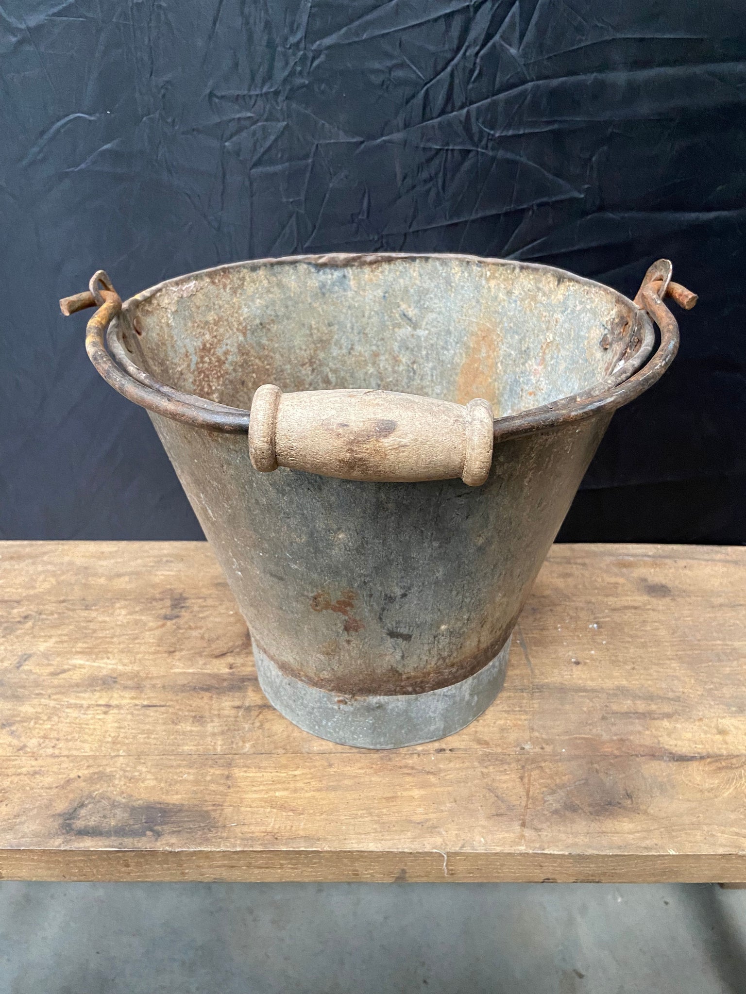 Bucket with a Wooden Grip