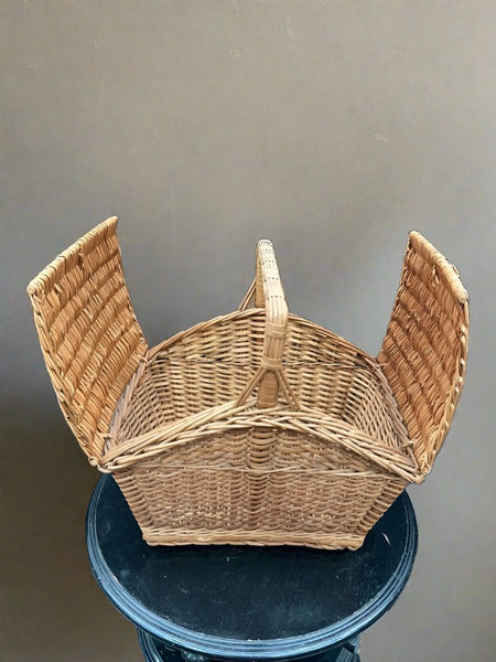 Traditional double-lidded wicker picnic basket.