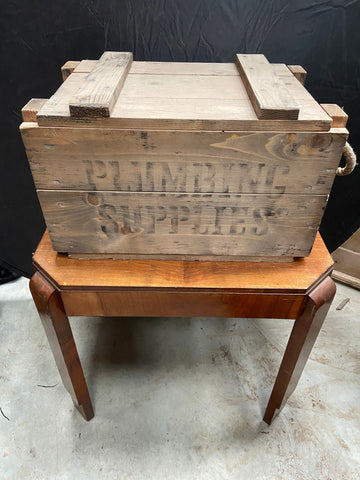 Rustic wooden crate stamped in black ink with 'Plumbing Supplies' Ashwood Film TV Props London
