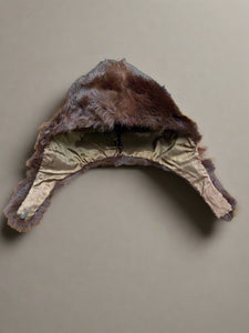 Vintage brown fur hat with ear covers.