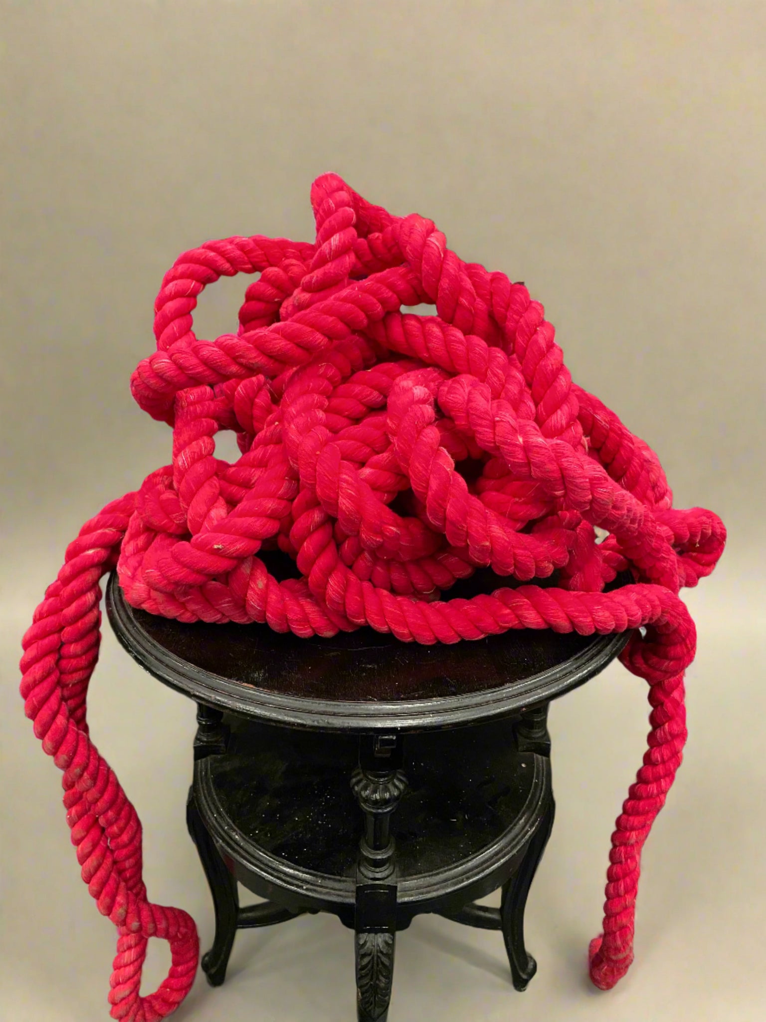 A big bundle of really thick neon pink rope.