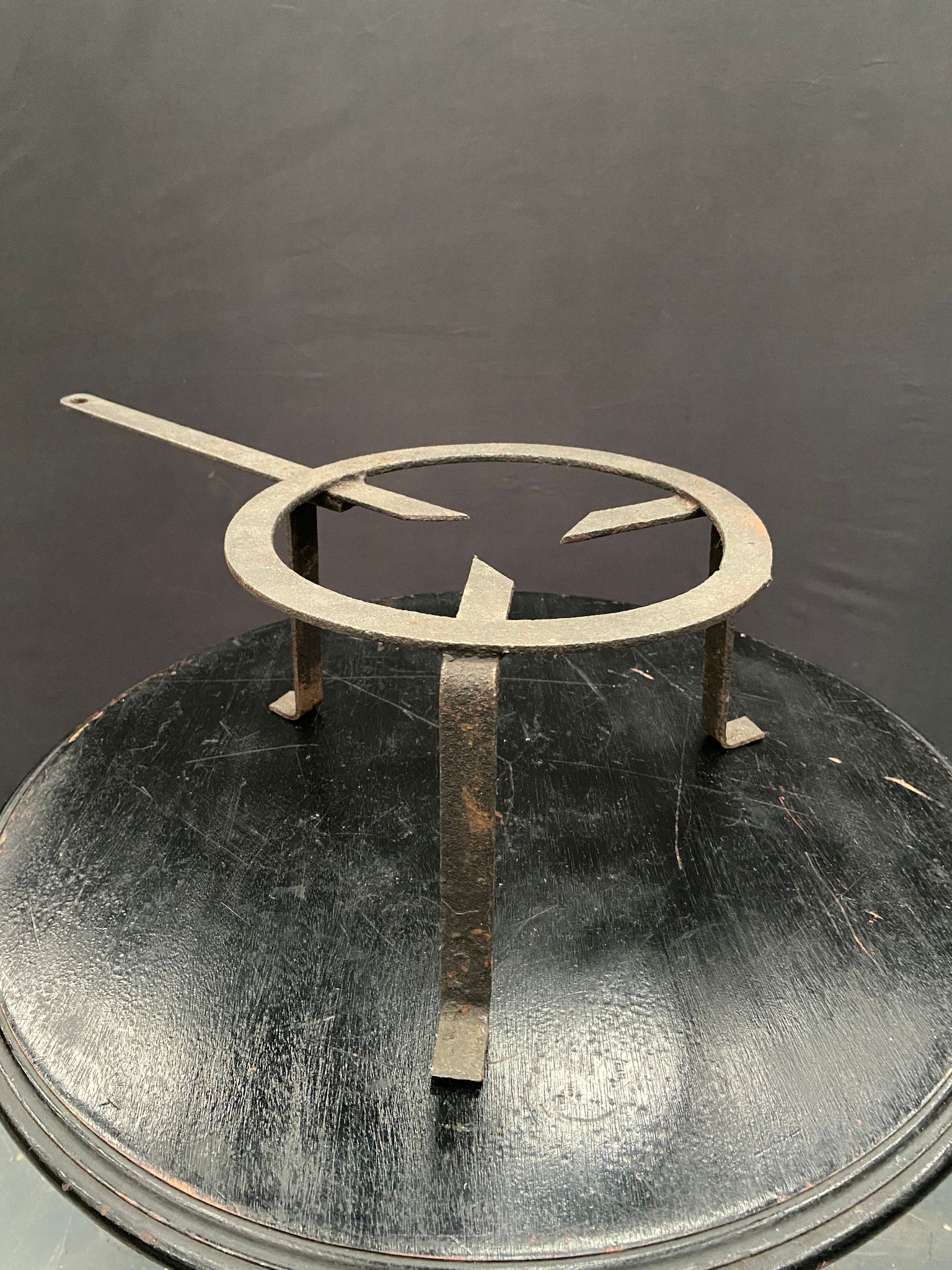 Cast iron campfire trivet pan stand.