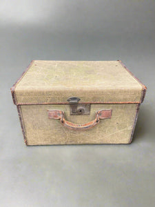 Square khaki canvas and leather travelling trunk. Could be used as hat transportation.