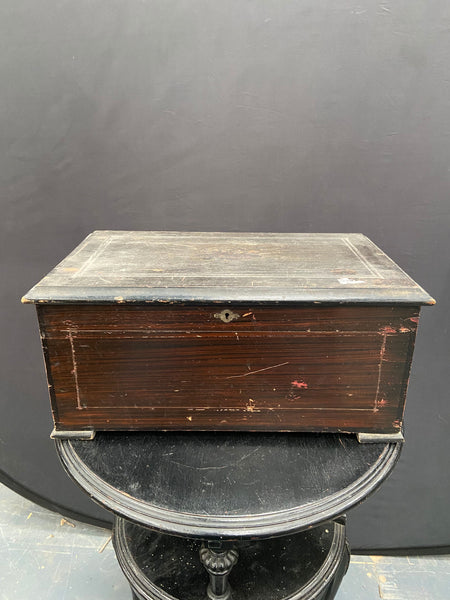 Large antique hand-turned musical box encased in a dark wooden box.&nbsp;