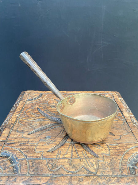 A Set of Brass Saucepans