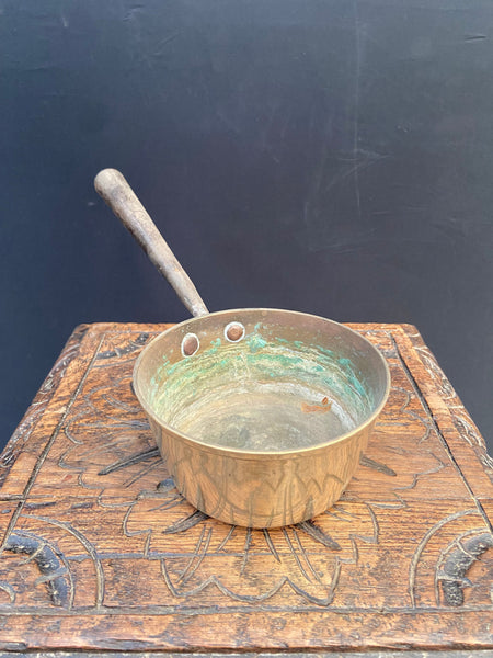 A set of antique brass saucepans, in 3 sizes. Likely Victorian.