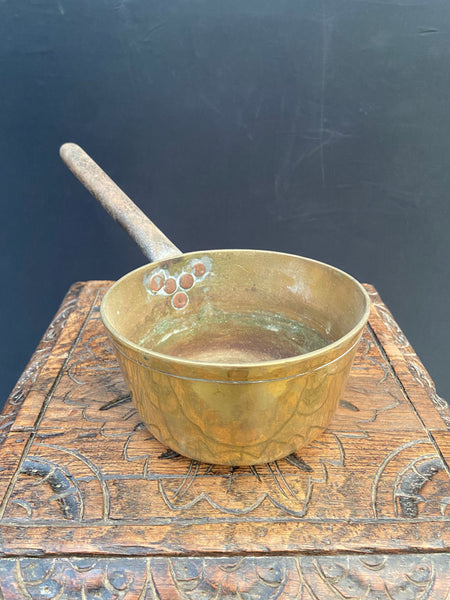 A set of antique brass saucepans, in 3 sizes. Likely Victorian.