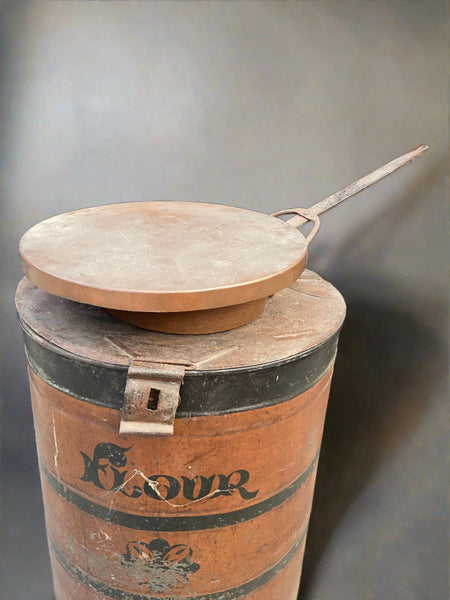 Antique deep copper cooking skillet with a large lid.