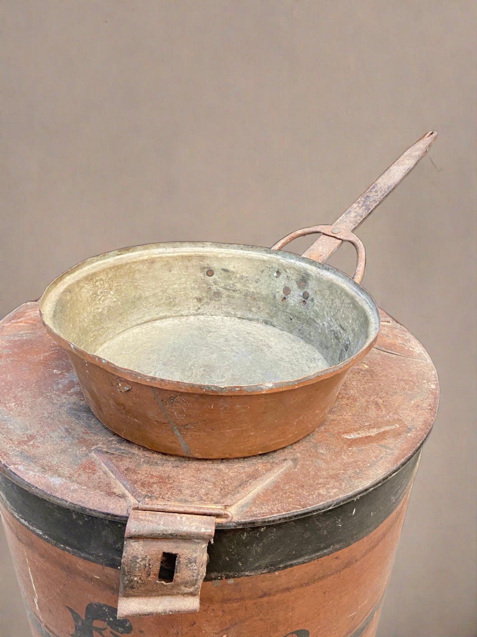 Antique deep copper cooking skillet with a large lid.