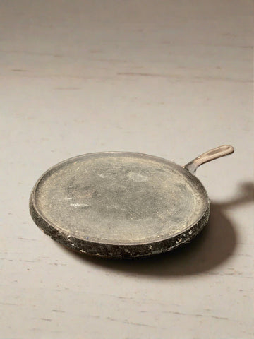 Shallow cast iron pancake/ crepe skillet pan.