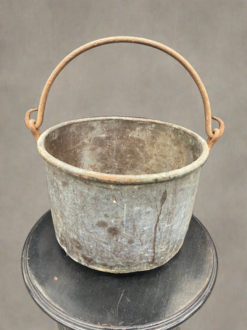 Large fireside cooking cauldron pot in an aged condition.