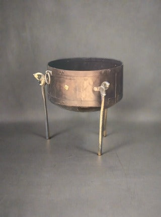 Antique copper kettle cauldron with bronze legs topped with a cast seahorse design.