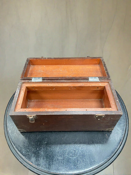Antique workman's chest with a flat top and hinged lid.