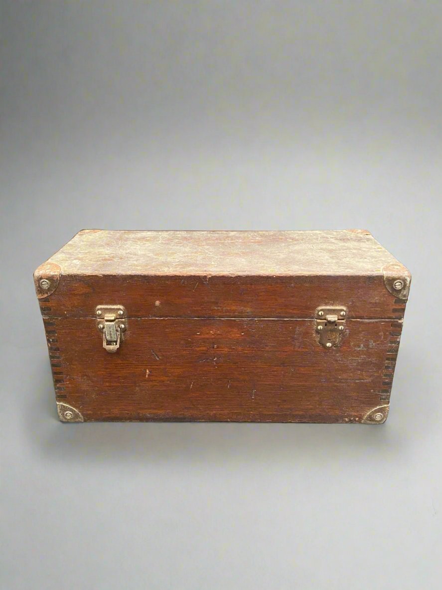 Antique workman's chest with a flat top and hinged lid.