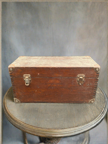 Antique workman's chest with a flat top and hinged lid.