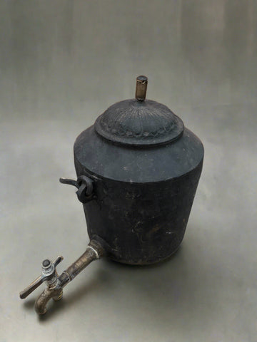 Victorian cast iron water boiler with a handle for hanging over an open fire.